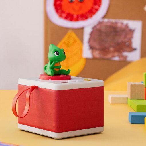 Red FABA children's storytime set featuring the "Chameleon of Emotions," on a table with play materials