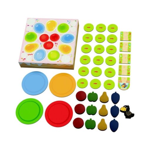 La Tarta de Teo de HABA: reverso de las cartas y platos de colores junto a la tarta