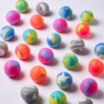 Gradient Squishy de J'adore: muchos squishies de colores mezclados repartidos sobre fondo blanco