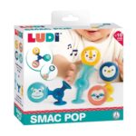 Smac Pop de Ludi: caja con un bebé jugando con las ventosas y las bolas con caras de animales