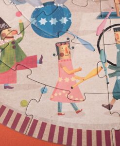 Puzzle redondo Circus round de Londji: detalle de una malabarista y un payaso con bolos sobre la pista