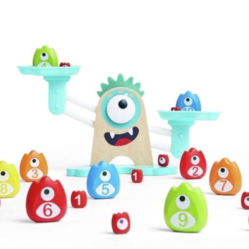 Báscula matemática Monstruosa de Hape: monstruos numerados y cubos con números colocados delante de la báscula