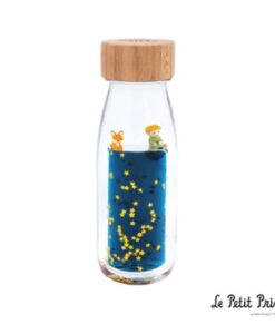Botella sensorial El Principito de Petit Boum: botella con tapón de madera, líquido azul, estrellas y figuras